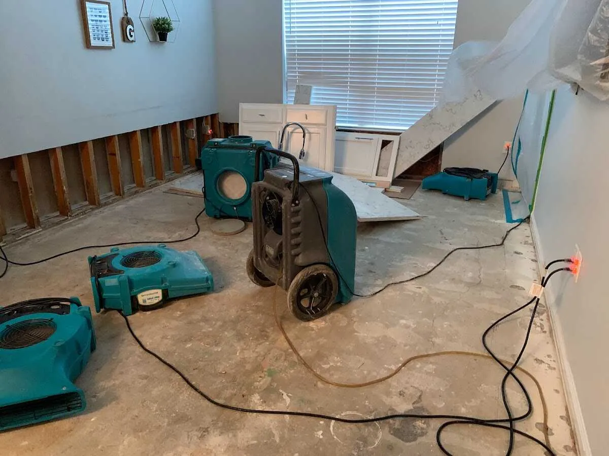 Dehumidifier in flood-cut room for Water Damage Restoration in Green Lake