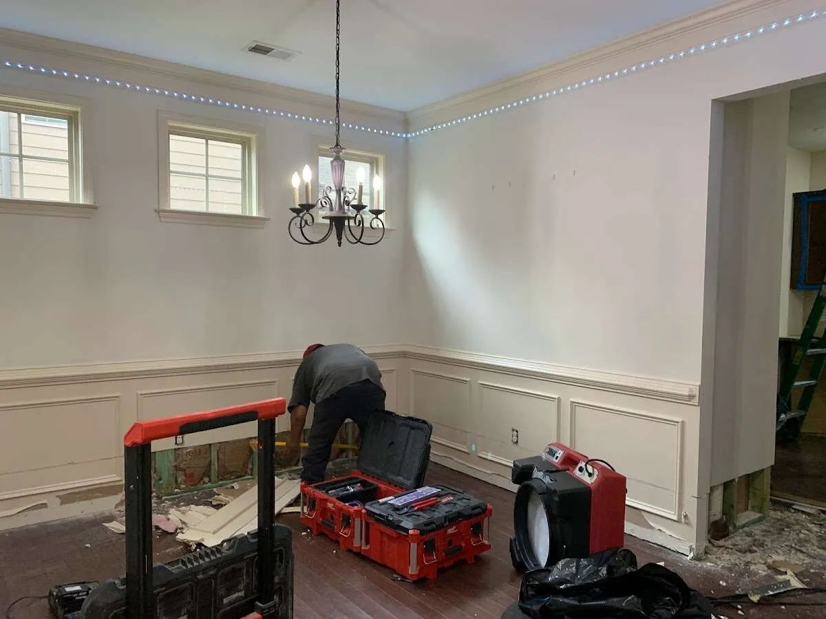 Restoration technician with professional equipment in Green Lake